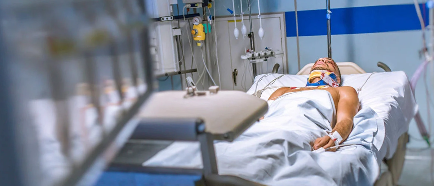 A man lying in a hospital bed