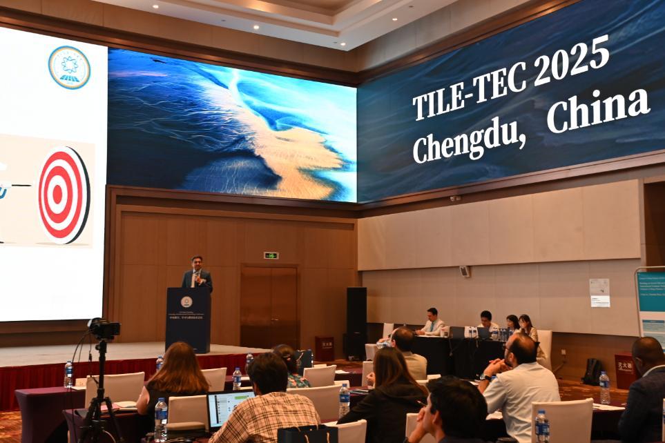 An image of Dr Wasim Ahmed on front of the TILE TEC 2025 conference