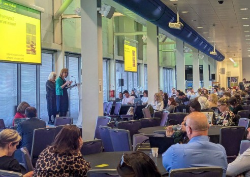 Image of presentation and discussion at the camau symposium