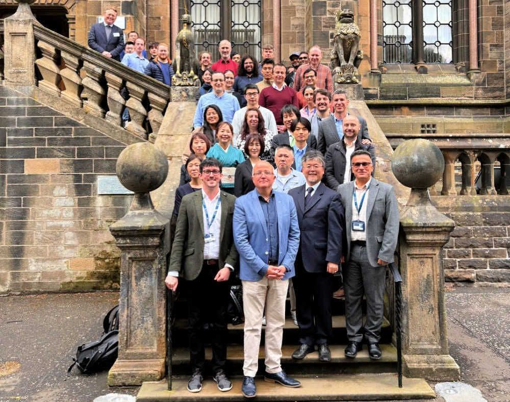 Glasgow and Tokyo delegates in a group photo on the Lion and Unicorn Staircase at the Gilmorehill campus