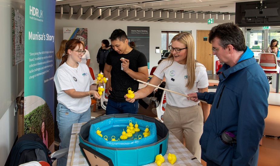 Tabletop activity hooking yellow rubber ducks with a rod