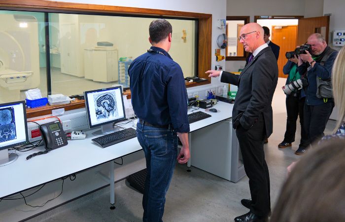 First Minister John Swinney Looking at 7T MRI Scanner