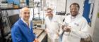 Dr Paul Prentice, Professor Mark Symes, and Dr Lukman Yusuf of the University of Glasgow pose with the £20 prototype device they built to produce nitrate from water and air using ultrasound