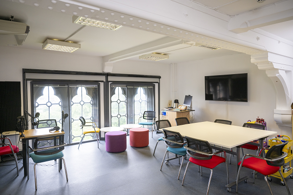 Creative Impact Lab room with tables and chairs