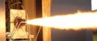 A photo of a rocket being test-fired at MachLab