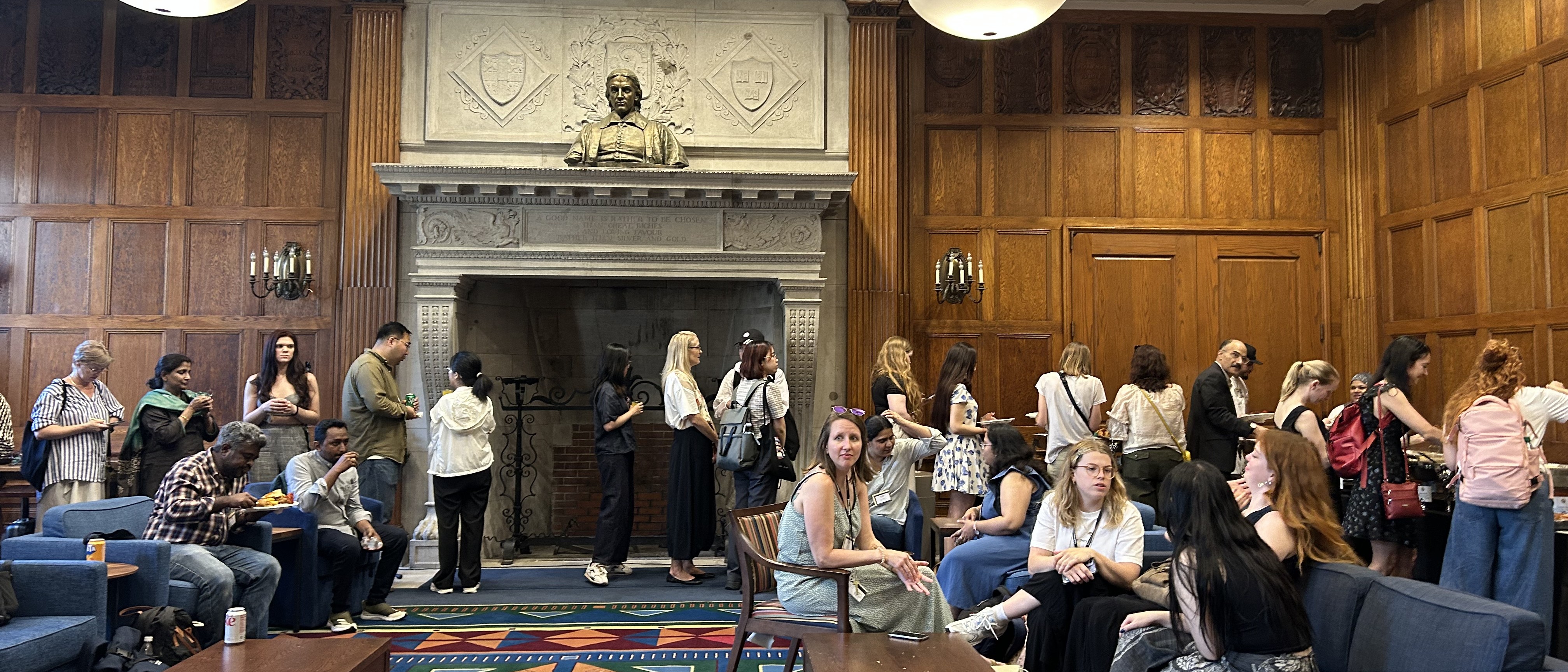 A crowd of students and researchers congregating in a room at Harvard University