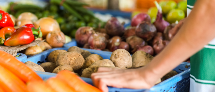Array of fresh fruit and vegetables at an outdoor market