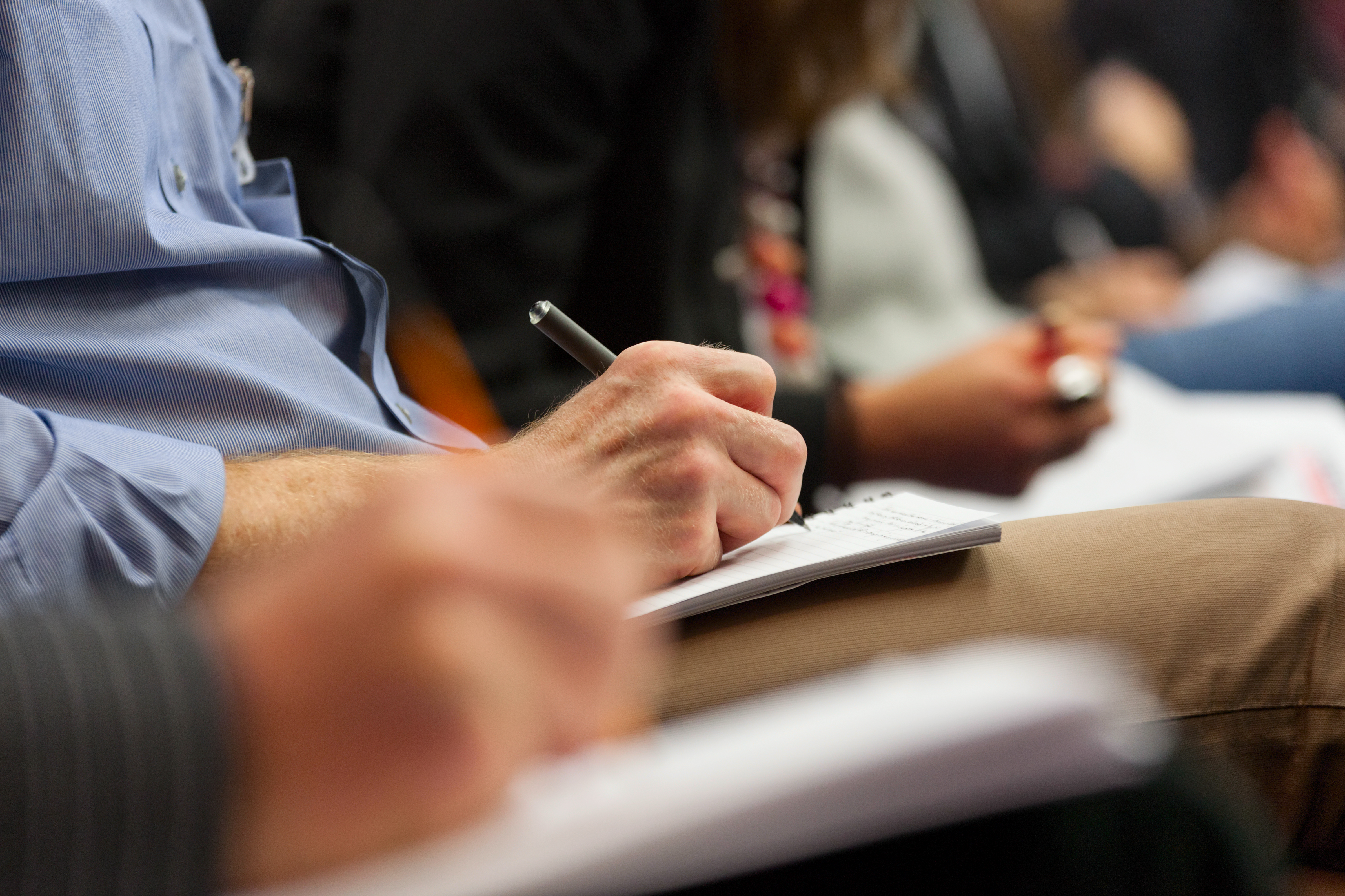 Close-up of a hand writing notes