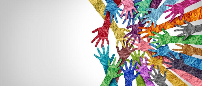 Several paper hands reaching to each other