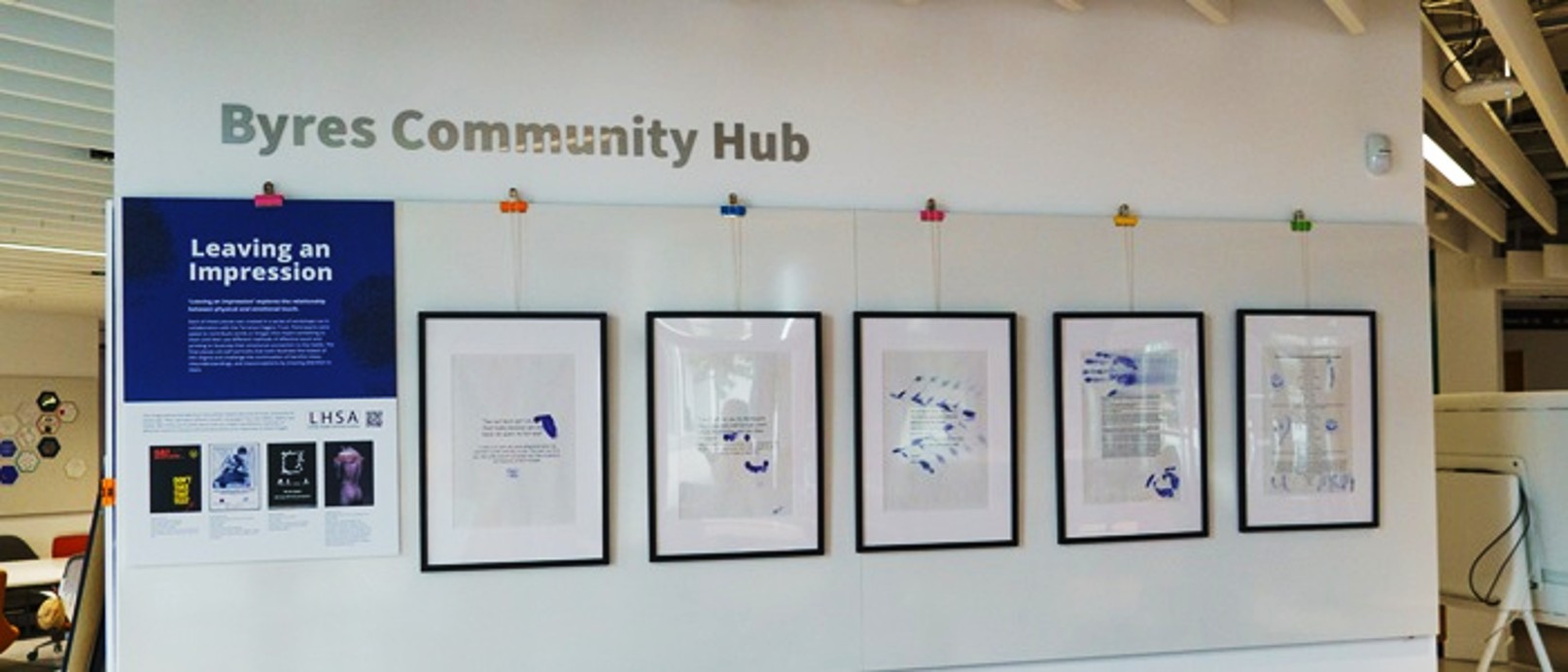 Leaving an impression exhibition with black framed posters