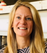 A head and shoulders portrait shot of Dr Eve Smith in the lab