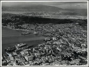 An aerial photograph (by Whites Aviation Ltd) of the Gourock Ropeworks' office (location indicated by a small white arrow and circle in the bottom left hand corner) in Wellington, New Zealand, c1920s.  (GUAS Ref: UGD 42/9/4/4. Copyright reserved.) 