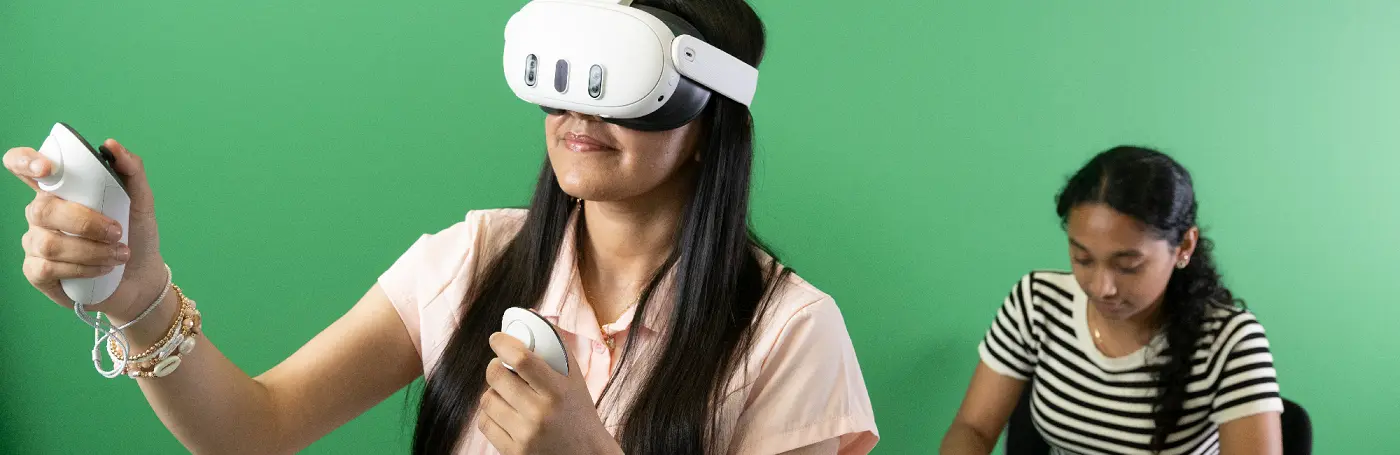 Students with VR headsets and green background