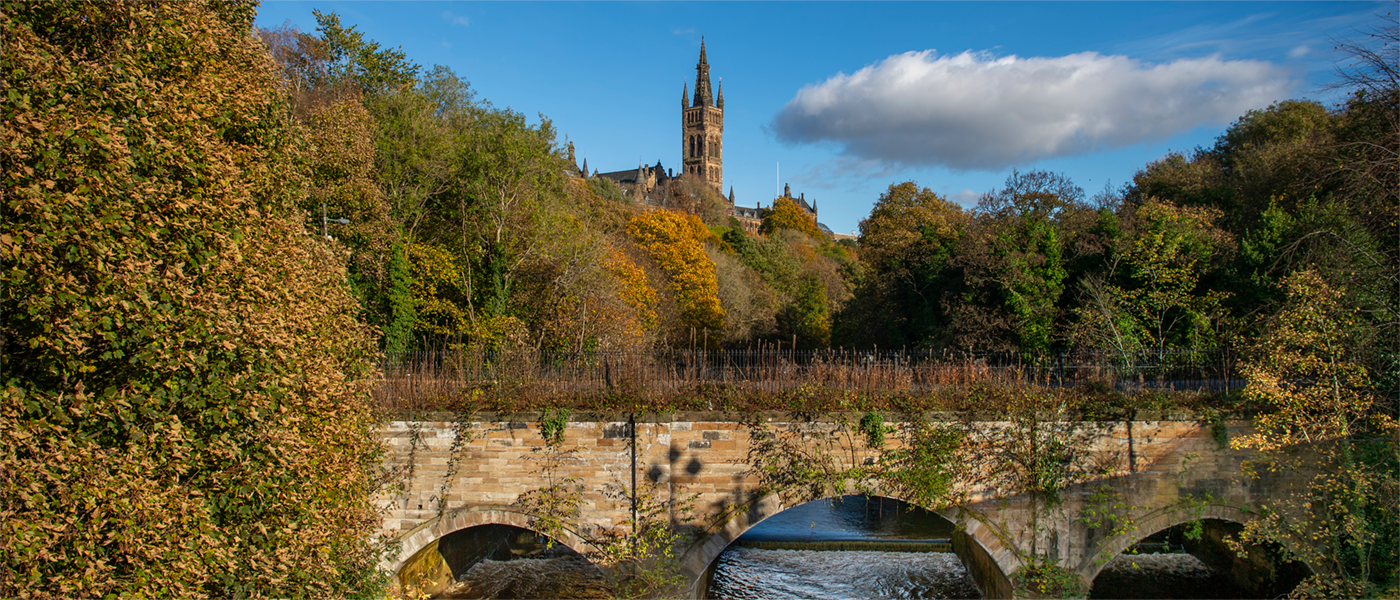 The Gilbert Scott Building pictured beside the River Kelvin