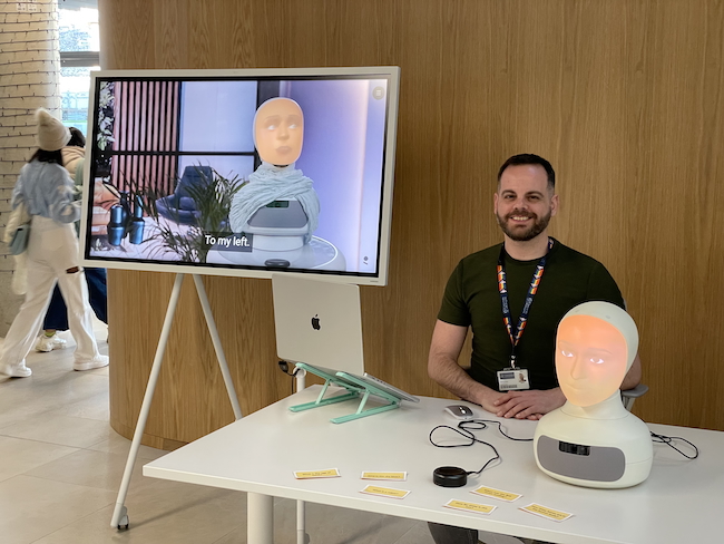 A photograph of Shaul Ashkenazi with the Furhat robot