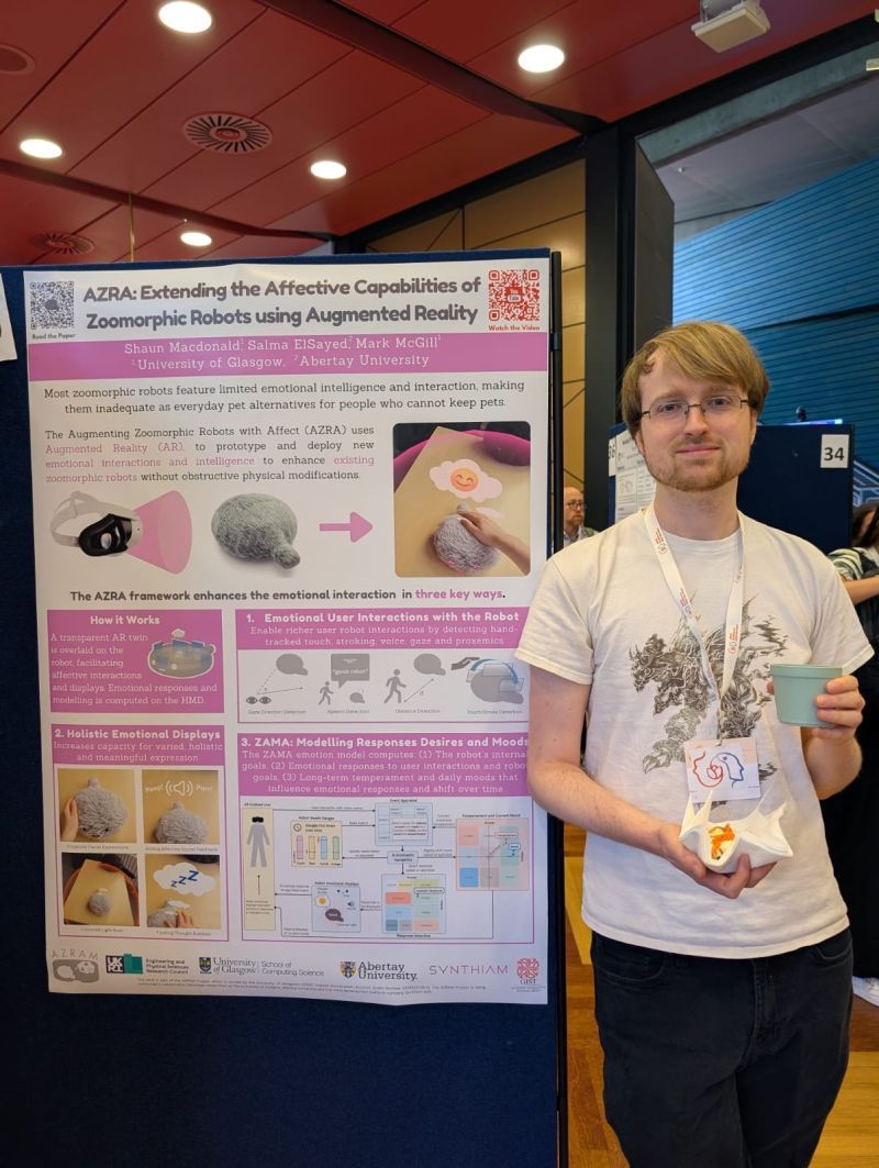 Person standing next to a research poster.