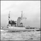 A photograph of the tugboat Hashim, built for the Iraqi Government by Scotts & Sons of Bowling, on trials in the Firth of Clyde, 1950s.  (GUAS Ref: GD 322/13/14.  Copyright reserved.)