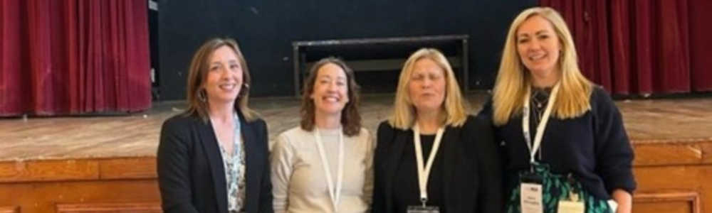 Laura McCaughey stood with keynote speakers Sarah Hunt (Skills Development Scotland) and Yvonne Bayne (Fife College), and Professor Claire Garden, chair of the SULSA Skills Committee in front of a stage together. From left to right: Sarah Hunt, Claire Garden, Yvonne Bayne & Laura McCaughey