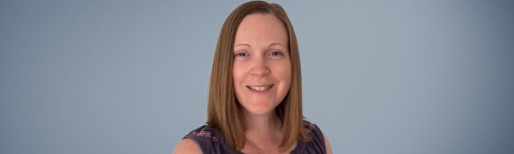 A head and shoulders portrait shot of Professor Nicola Veitch against a shaded grey background