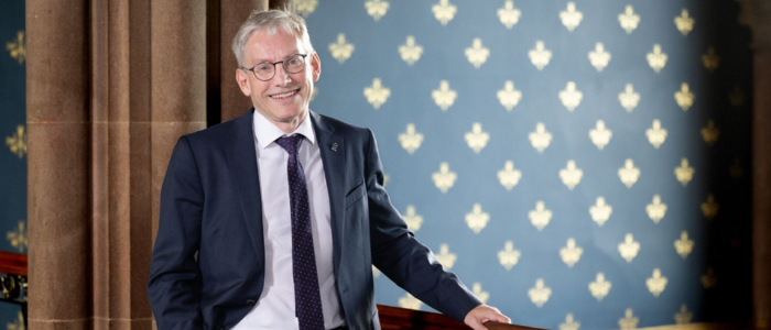 Photo of the new principal smiling at the camera