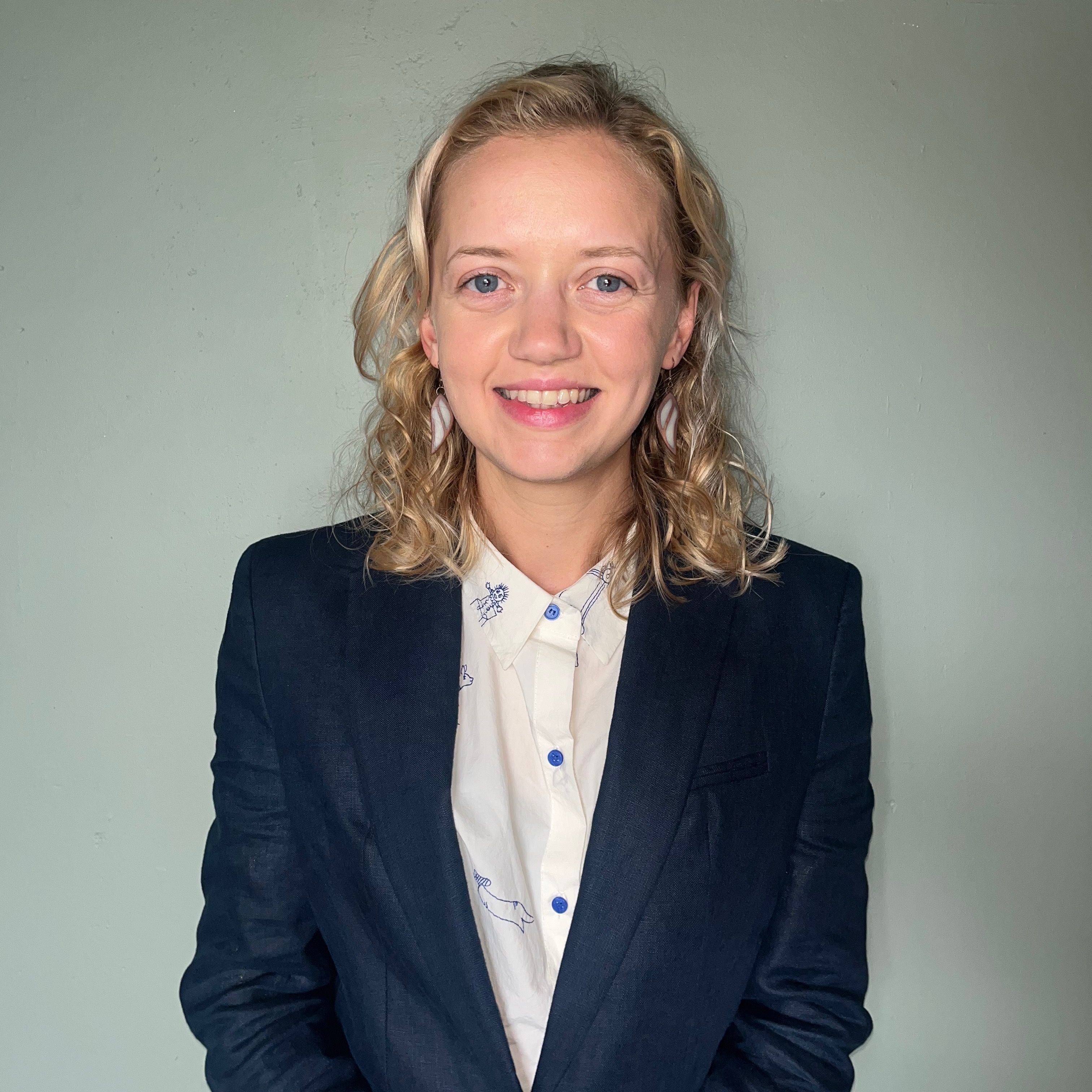Portrait of a young woman in a business jacket