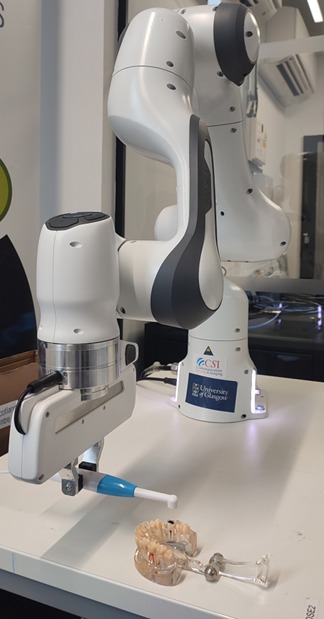 A photo of the team's robotic arm in action