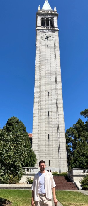Professor standing in front of the Sather Tower at UC Berkeley campus, California USA