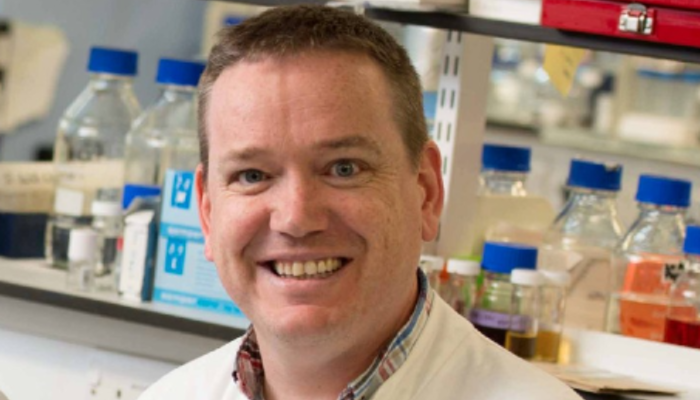 A head and shoulders portrait shot of Professor Wall in the lab