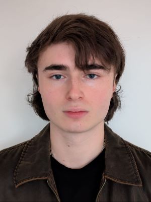 Headshot of white male with dark hair