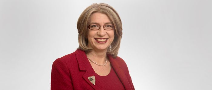 Professor Ros Searle smiling at camera