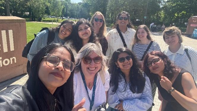 Academic staff and students taking a selfie on a field trip