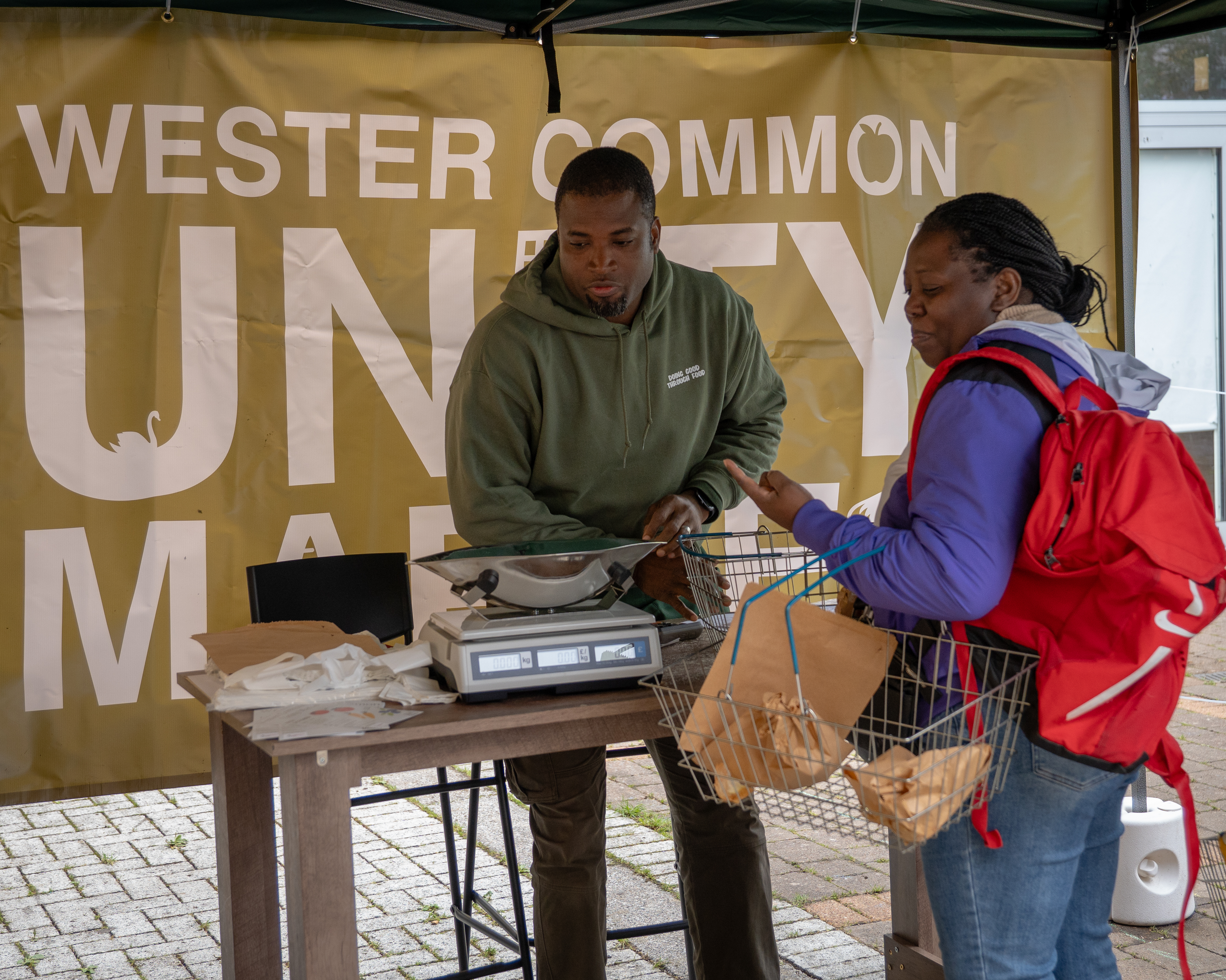 customer purchasing goods at the market