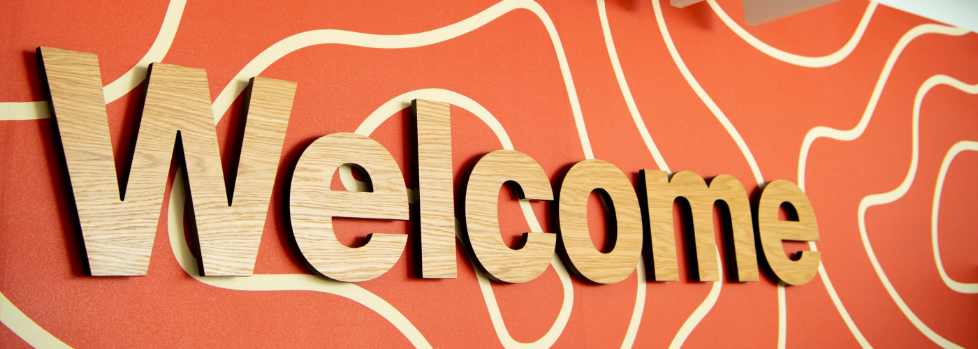 A photograph of the sign which says WELCOME in the Clarice Pears Building