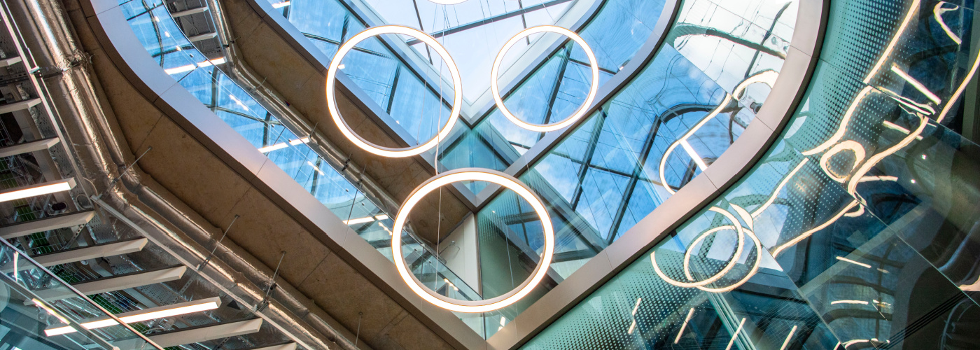 A photograph of the circular lighting on the ceiling of the Advanced Research Centre