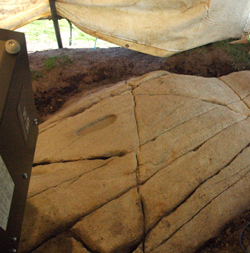 Laser scanning the rock surface with the inauguration footprint and ogham inscription visible