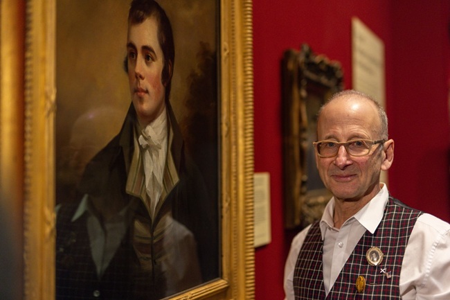 Dr William Zachs photographed with re-discovered portrait of Robert Burns by Henry Raeburn. Credit Nick Mailer