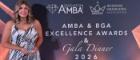 Photo of Jan holding an AMBA Excellence award on stage