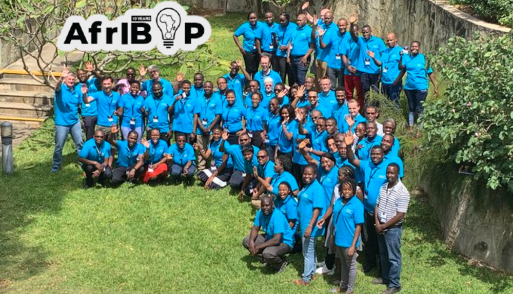 An image from AfrIBOP 2019 in which participants are stood together in blue t-shirts in an alignment to represent the shape of the African continent on a world map