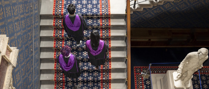 Aerial view of students going up stairs to Graduation ceremony