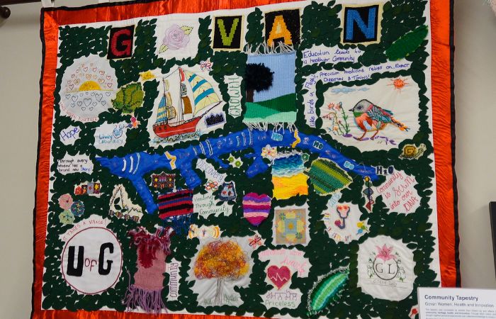 A tapestry artwork showcasing a ship, bird, and more