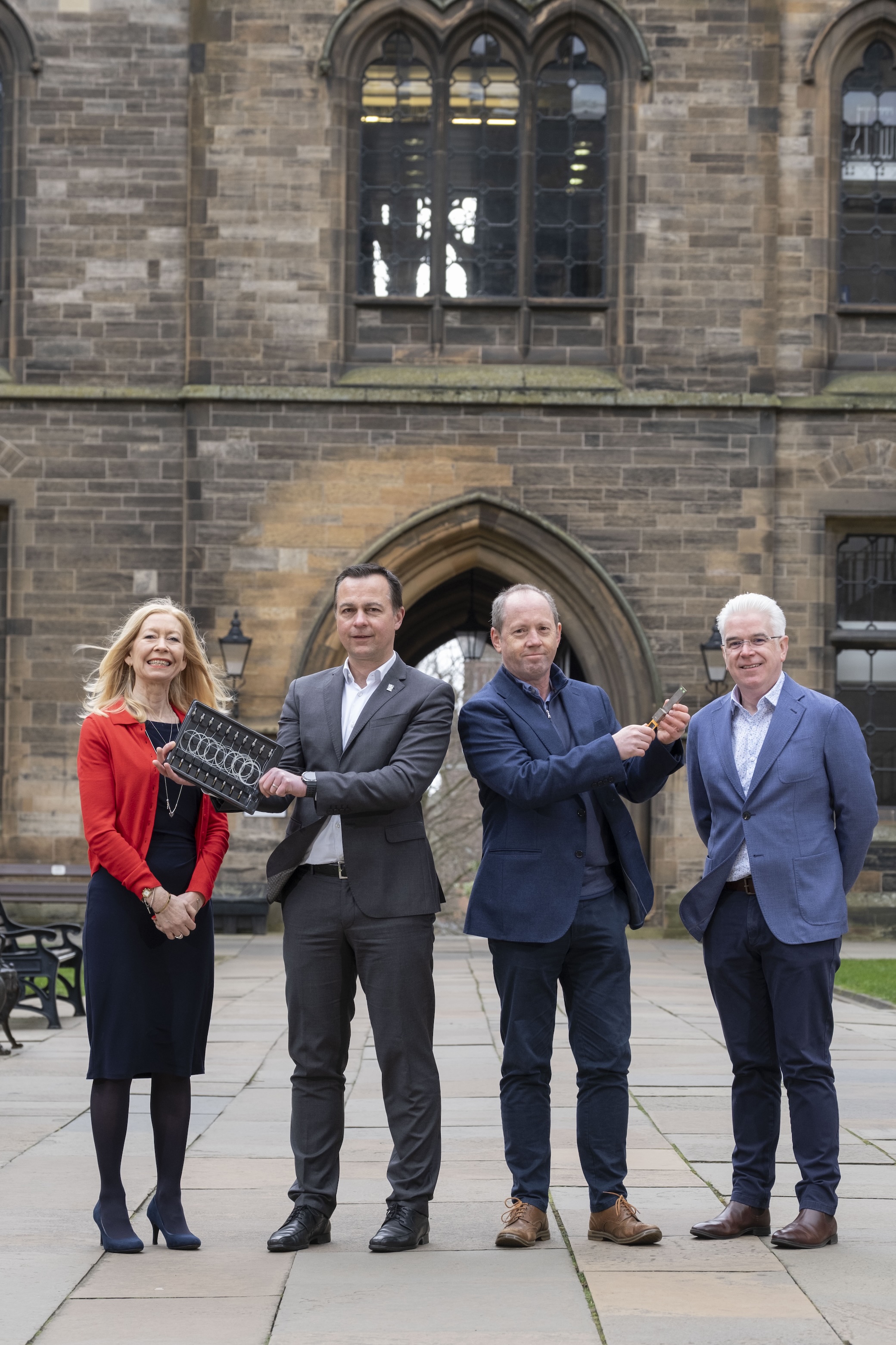 centre l-r) JWNC director of strategy Evelyn Toma, JWNC director Professor Martin Weides, Sivers Semiconductor CTO Andrew McKee and Kelvin Nanotechnology CEO Brendan Casey hold components developed by Sivers and manufactured in partnership with the JWNC.