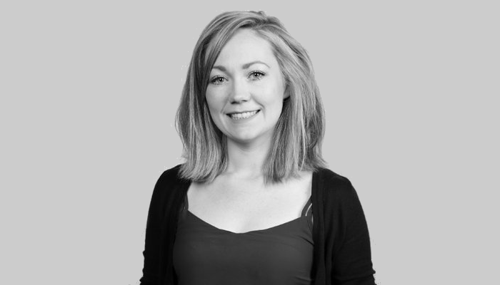 A head and shoulders portrait show of Dr Laura McCaughey in black and white