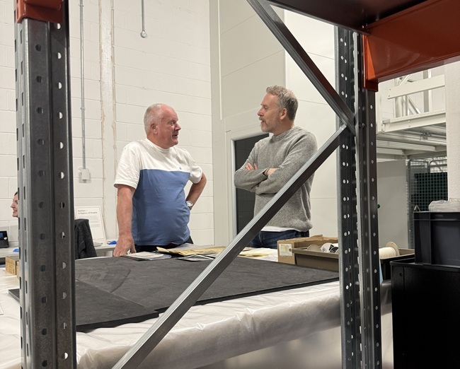 Paul English interviewing Allan Forrest in the Kelvin Hall Glasgow Life Museums store. Credit Kenny Brophy