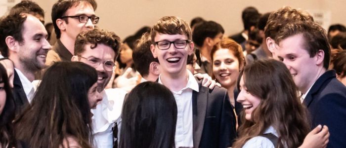 Group of students hugging after a team success