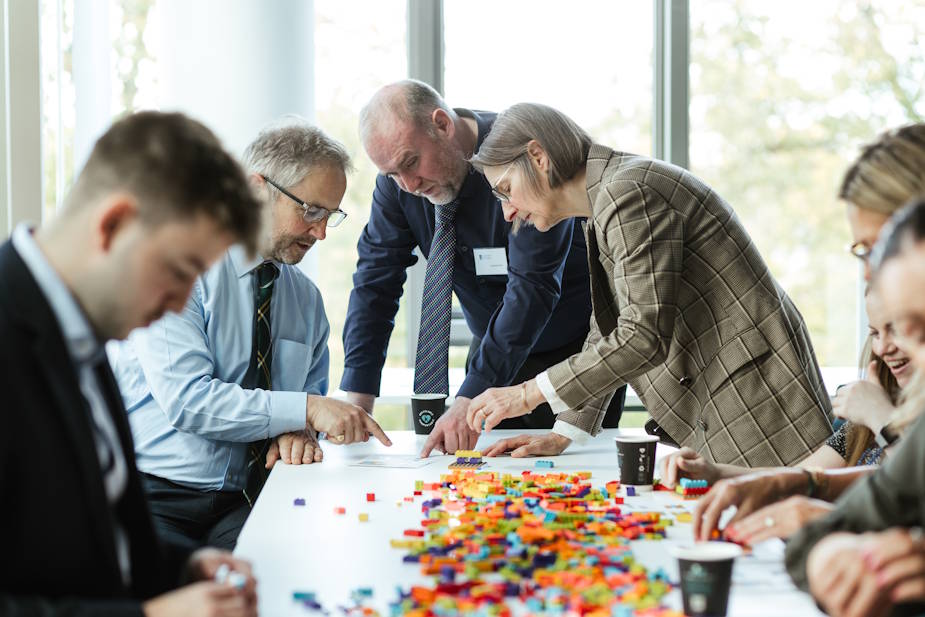 adults playing with lego