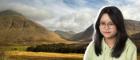 Student with mountains in the background