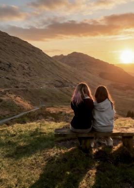 two people looking at the sunset