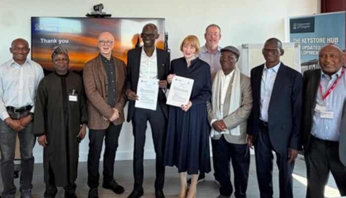 Delegates from the University of Glasgow and Ahmadu Bello University (ABU), Nigeria, stand together following the signing of a Memorandum of Understanding (MoU). At the centre, Professor Ahmed Adamu, Vice Chancellor of ABU, and Professor Rachel Sandison, Deputy Vice Chancellor for External Engagement and Vice Principal for External Relations at the University of Glasgow, hold the signed agreement documents. They are joined by Professor Harry de-Koning and other representatives from both institutions during the visit to the University of Glasgow in April 2026.