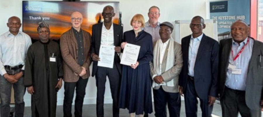 Delegates from the University of Glasgow and Ahmadu Bello University (ABU), Nigeria, stand together following the signing of a Memorandum of Understanding (MoU). At the centre, Professor Ahmed Adamu, Vice Chancellor of ABU, and Professor Rachel Sandison, Deputy Vice Chancellor for External Engagement and Vice Principal for External Relations at the University of Glasgow, hold the signed agreement documents. They are joined by Professor Harry de-Koning and other representatives from both institutions during the visit to the University of Glasgow in April 2026.