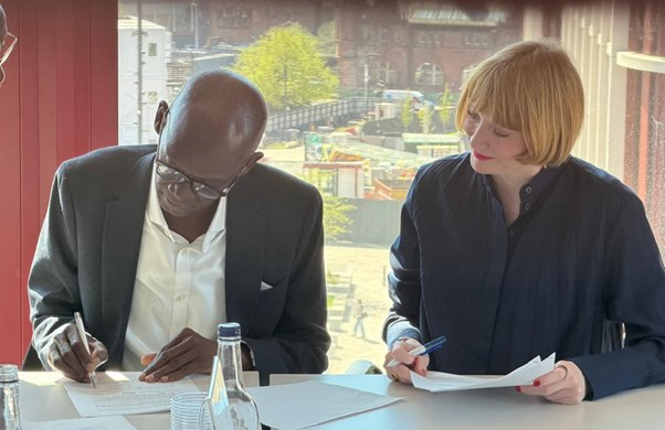 Professor Ahmed Adamu, Vice Chancellor of Ahmadu Bello University (ABU), and Professor Rachel Sandison, Deputy Vice Chancellor for External Engagement and Vice Principal for External Relations at the University of Glasgow, sign a Memorandum of Understanding (MoU) during a meeting at the University of Glasgow in April 2026.